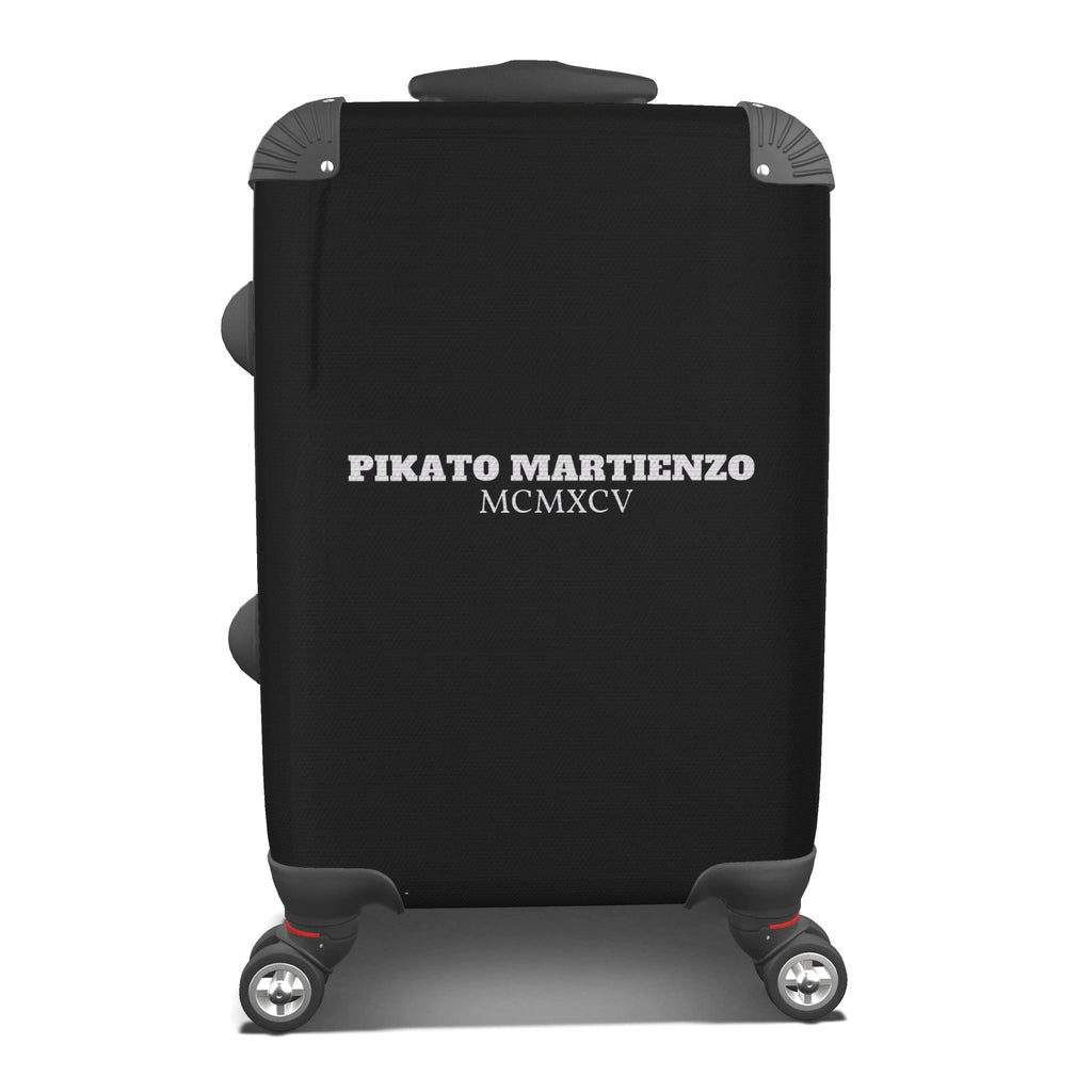 A black hard-shell suitcase with a black compression sleeve featuring the white text 'PIKATO MARTIENZO' and 'MCMXCV', shown on a plain white background.